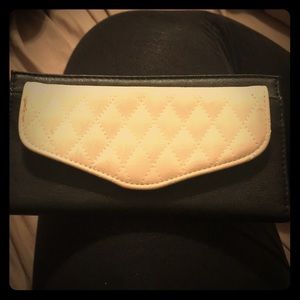 Cream and black pleather clutch